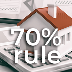 70 Percent Rule for Flipping A House - House illustration sitting on a calculator